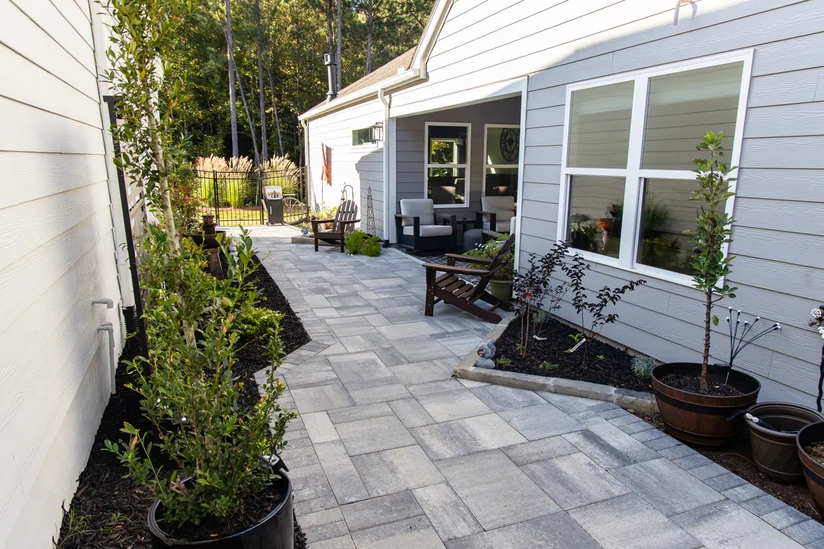 Paver side-passage with bench seating and planting beds at the Avery project by GreenTree Landscapes